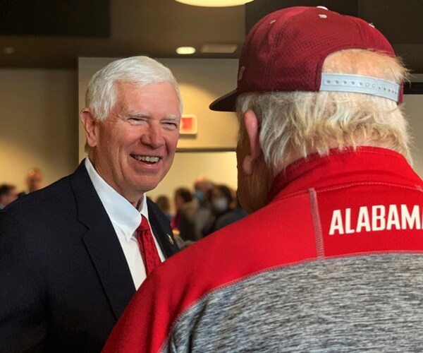 mo brooks smiles and speaks to the media