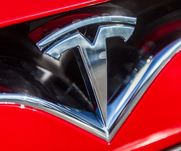 tesla logo on tesla car