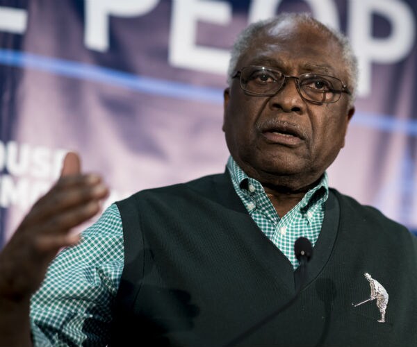 Rep. Jim Clyburn, D-S.C. speaking wearing green and white shirt and green sweater vest