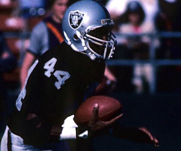 burgess owens returns an interception for the oakland raiders