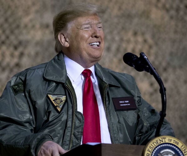 President Donald Trump wearing a bomber jacket