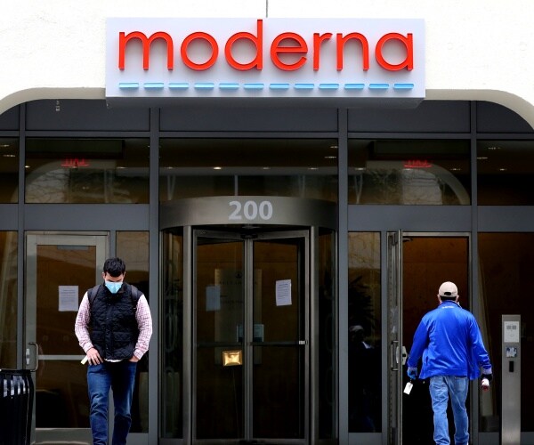 moderna hq building is shown with people walking in and out