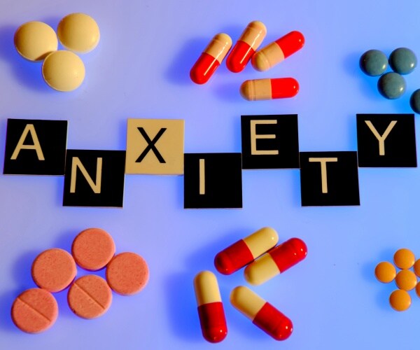 The word 'anxiety' with different pills around it