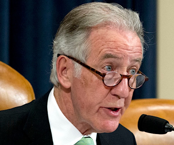 richard neal looks over the brim of his glasses during a house committee hearing