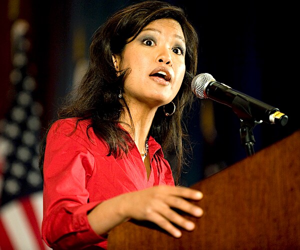 Michelle Malkin speaks at a lectern during a campaign rally