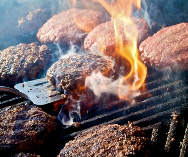 hamburgers cooking on outdoor grill