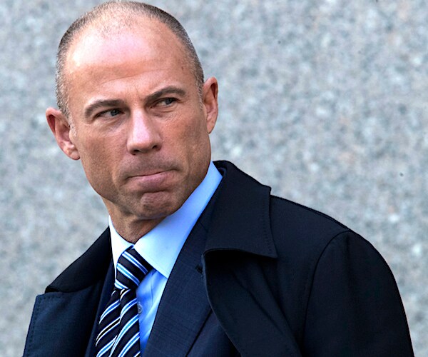 michael avenatti looks back over his left should with a smug expression