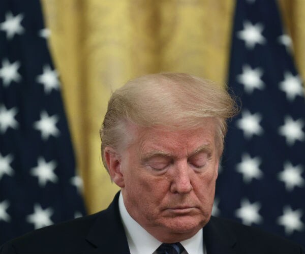 a dejected donald trump is shown