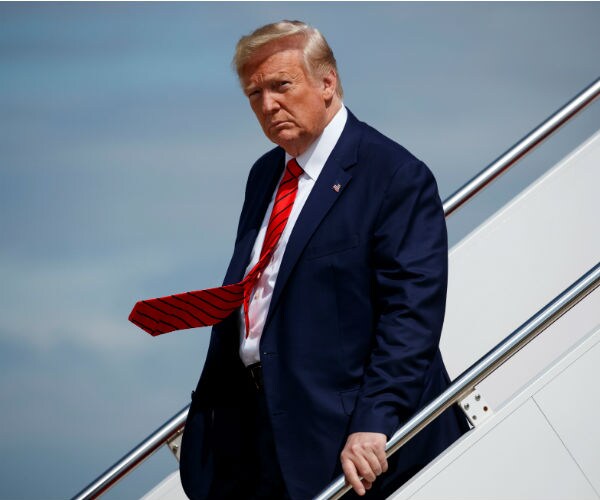 us president donald trump disembarking air force one at andrews afb