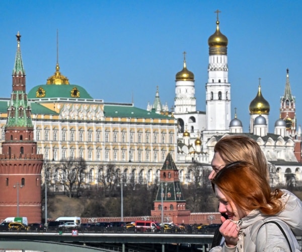 People walk on a bridge in central Moscow