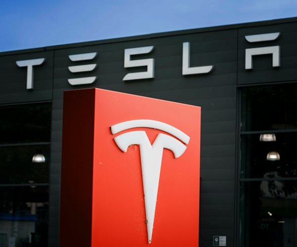 Tesla Shares Jump to Record High 