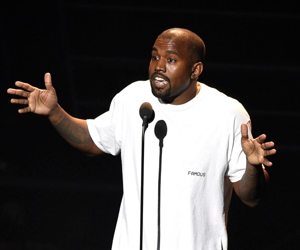 kanye west on a stage at the mtv video music awards.