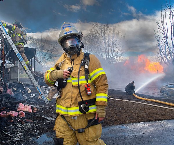 firefighters work to extinguish home and vehicle fires