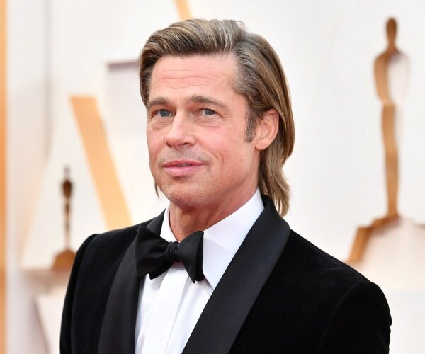 brad pitt in a black suit and bow tie