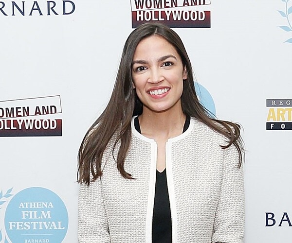 alexandria ocasio-cortez poses for a photo at a women's film festival