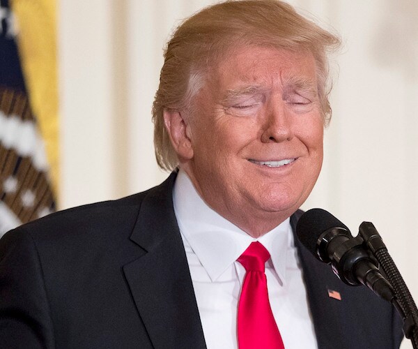 president donald trump makes a mocking face during a lighter moment of a news conference