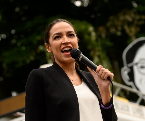 aoc speaks into mic