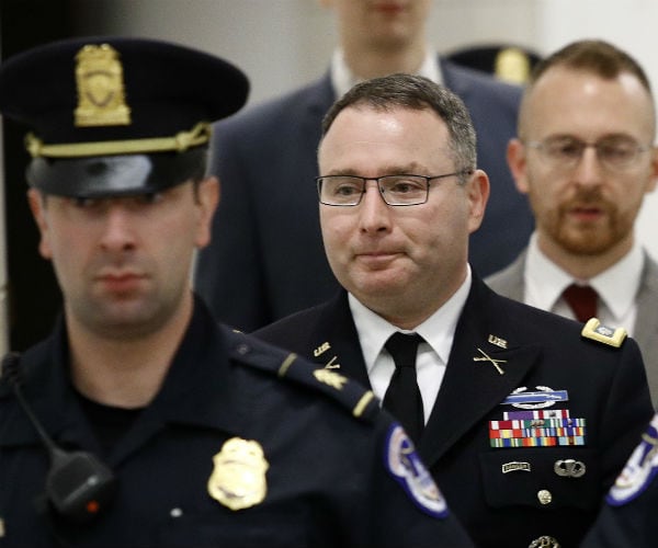 alexander vindman, departs a closed door meeting with a capitol police escort