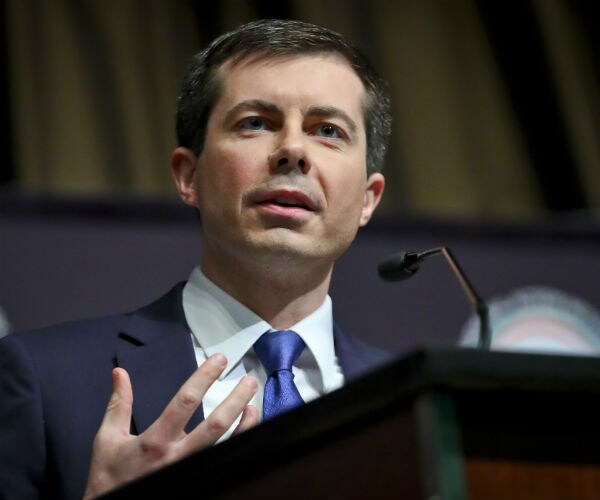 pete buttigieg speaking at a podium