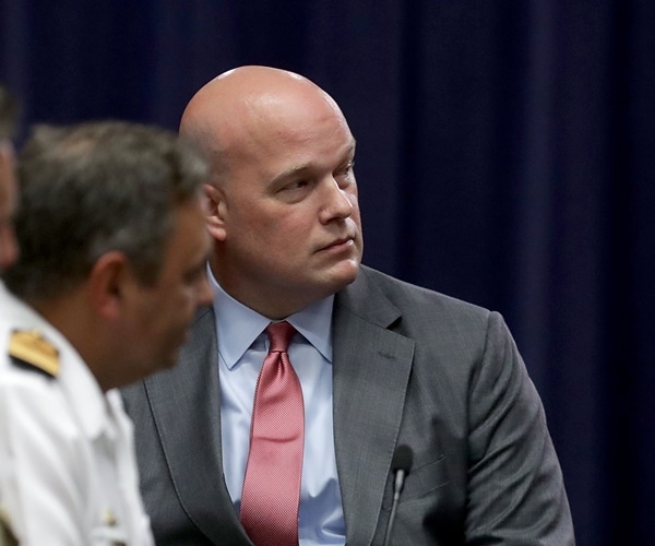 acting attorney general matt whitaker looks to his left