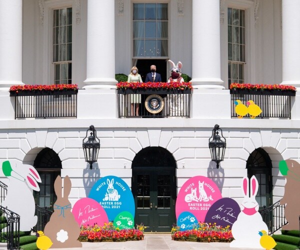 joe biden and jill biden stand next to the easter bunny at the white house