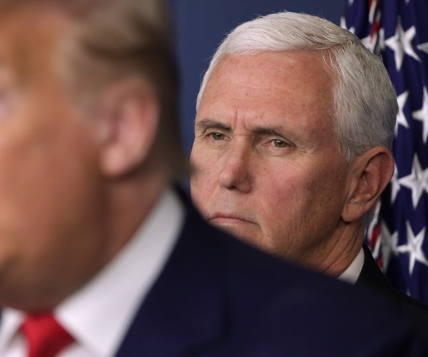 mike pence looks at the president