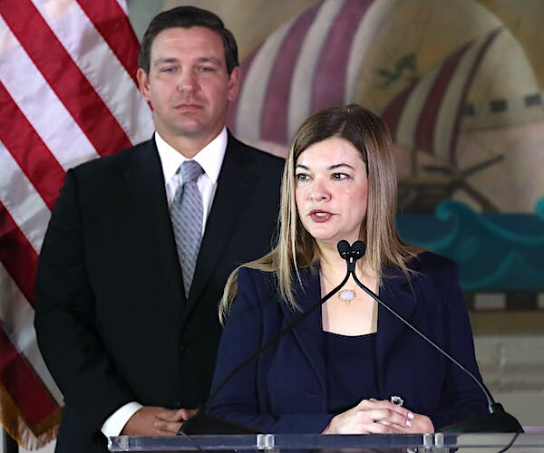 ron desantis stands behind barbara lagoa as she speaks after he named her to the Florida Supreme Court