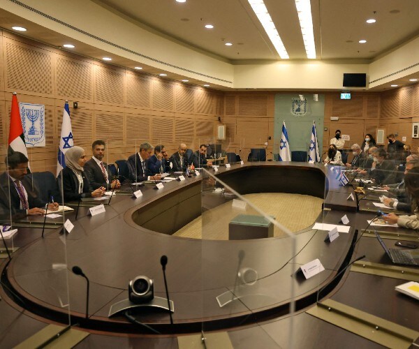 a large table with diplomats sitting around it