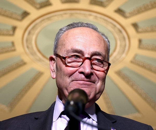 chuck schumer speaks into mic