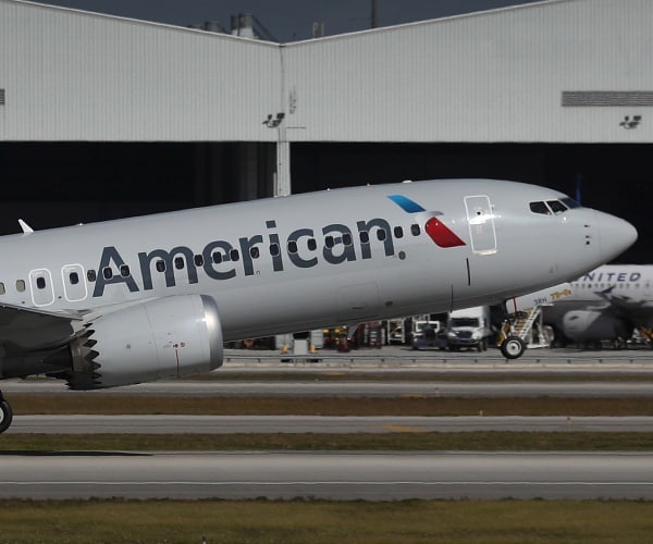 american airlines plane takes off from tarmac