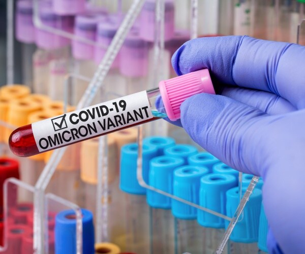 blood sample labeled "COVID-19 Omicron Variant"