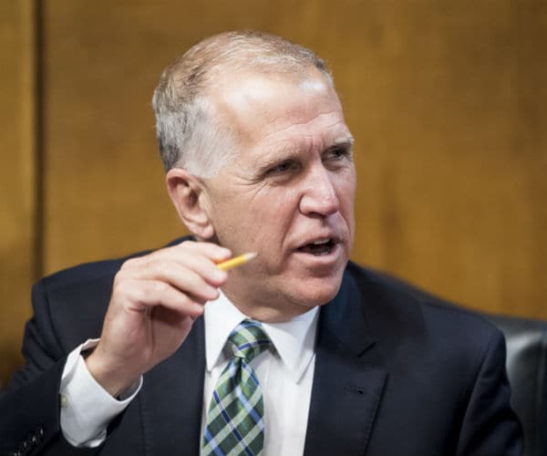 sen. thom tillis, R-N.C., chats with fellow senators in washington, d.c.