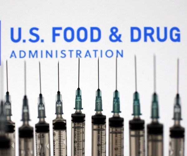 Food and Drug Administration spelled out behind syringes