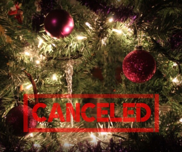 christmas tree with red label across it "canceled"