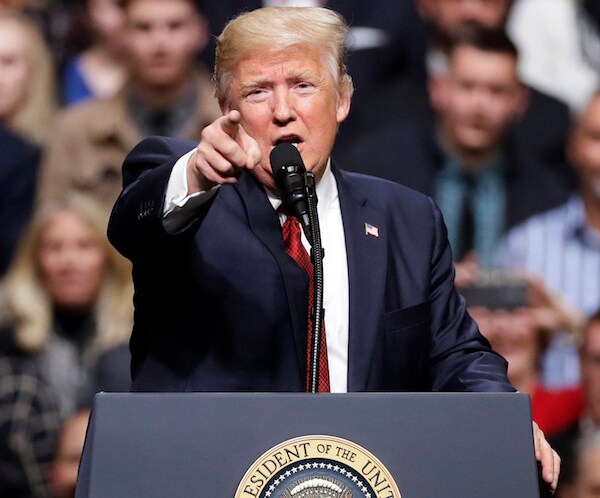 president donald trump points at the media during a republican campaign rally