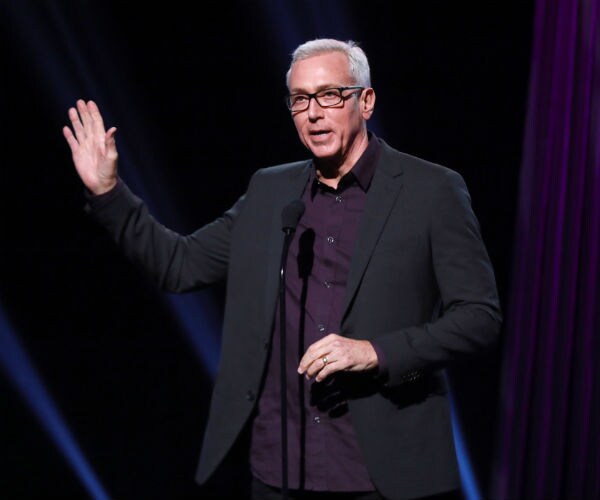 Drew Pinsky speaks onstage during the 2019 iHeartRadio Podcast Awards in Burbank, California.