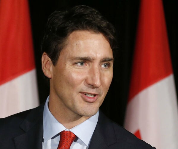 Canada's Trudeau Welcomes Refugees; U.S.-bound Passengers Turned Away