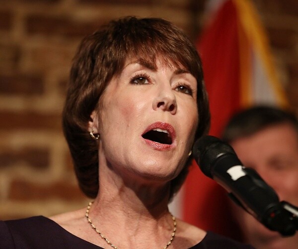 gwen graham speaks into microphone