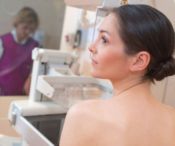 woman getting a mammogram