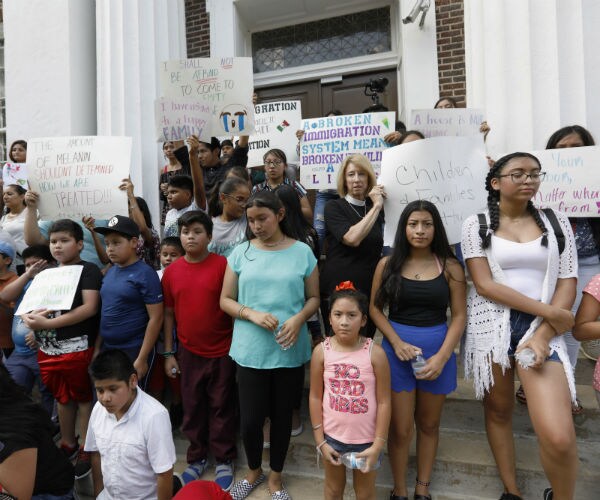 latino children protesting the arrests of their parents stand on the steps of courthouse in canton, mississippi