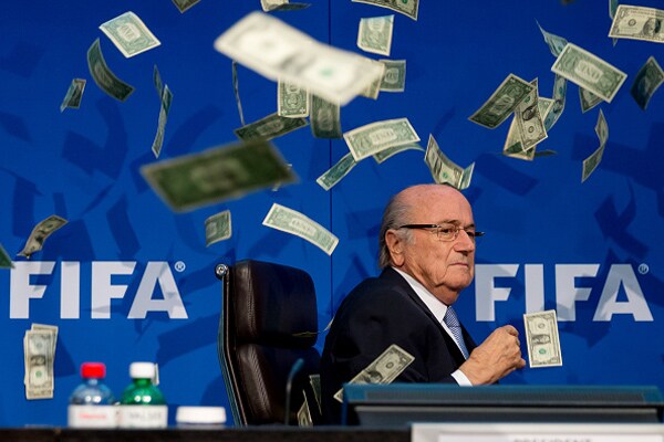 Simon Brodkin Showers FIFA Prez Sepp Blatter With Fake Money as Prank