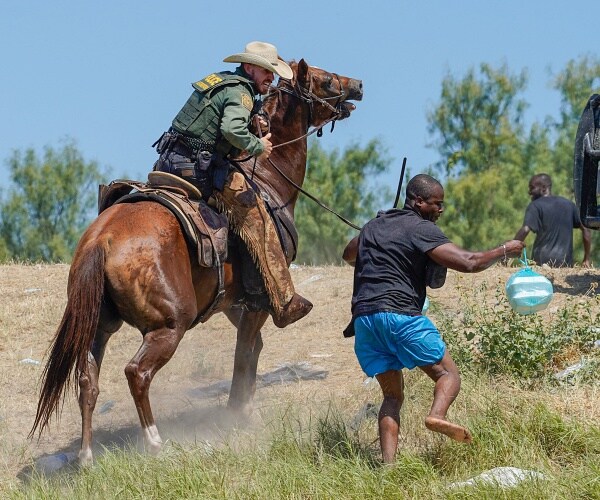 border patrol agent on horseback chases migrant