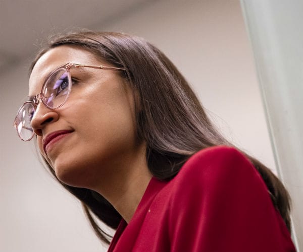 rep. alexandria ocasio-cortez is shown wearing glasses