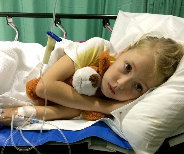 young sick girl in hospital