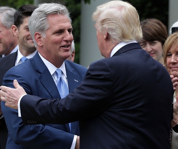 rep. kevin mccarthy shakes the hand of president donald trump