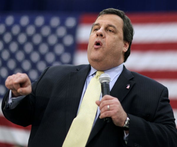 Former New Jersey Gov. Chris Christie  is seen with the american flag in the background