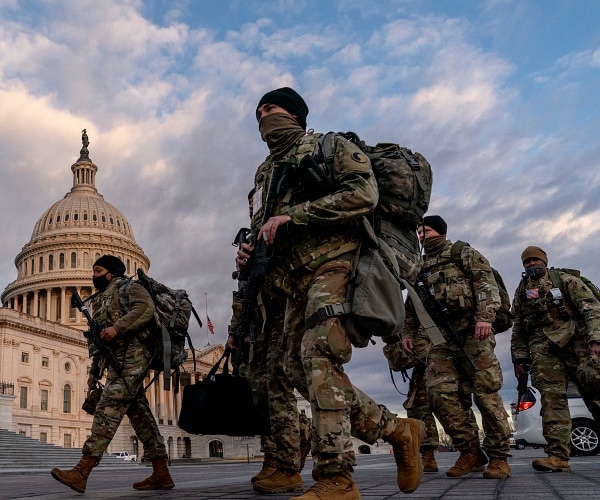 national guard troops walk past us capitol