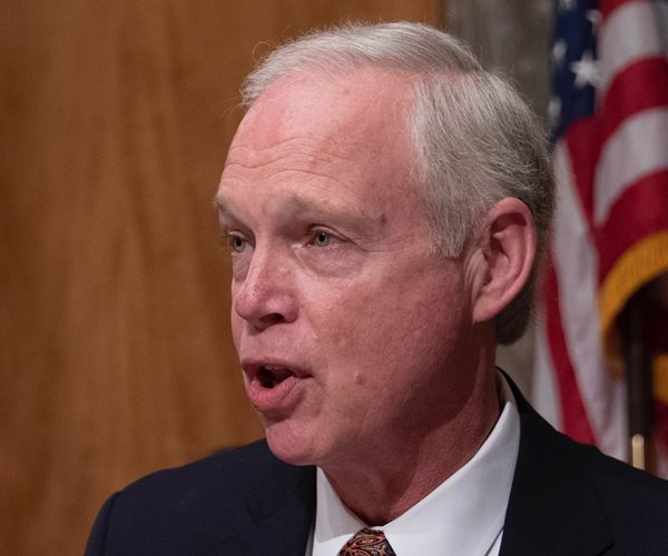 senator ron johnson faces to the left