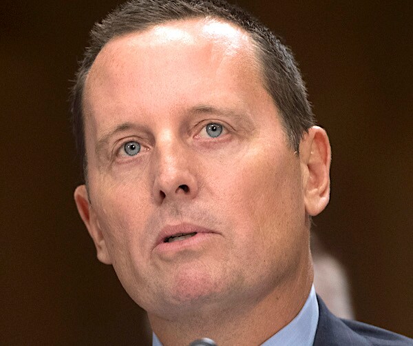 richard grenell looks up and listens during senate testimony