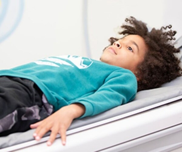 young boy undergoing CT scan